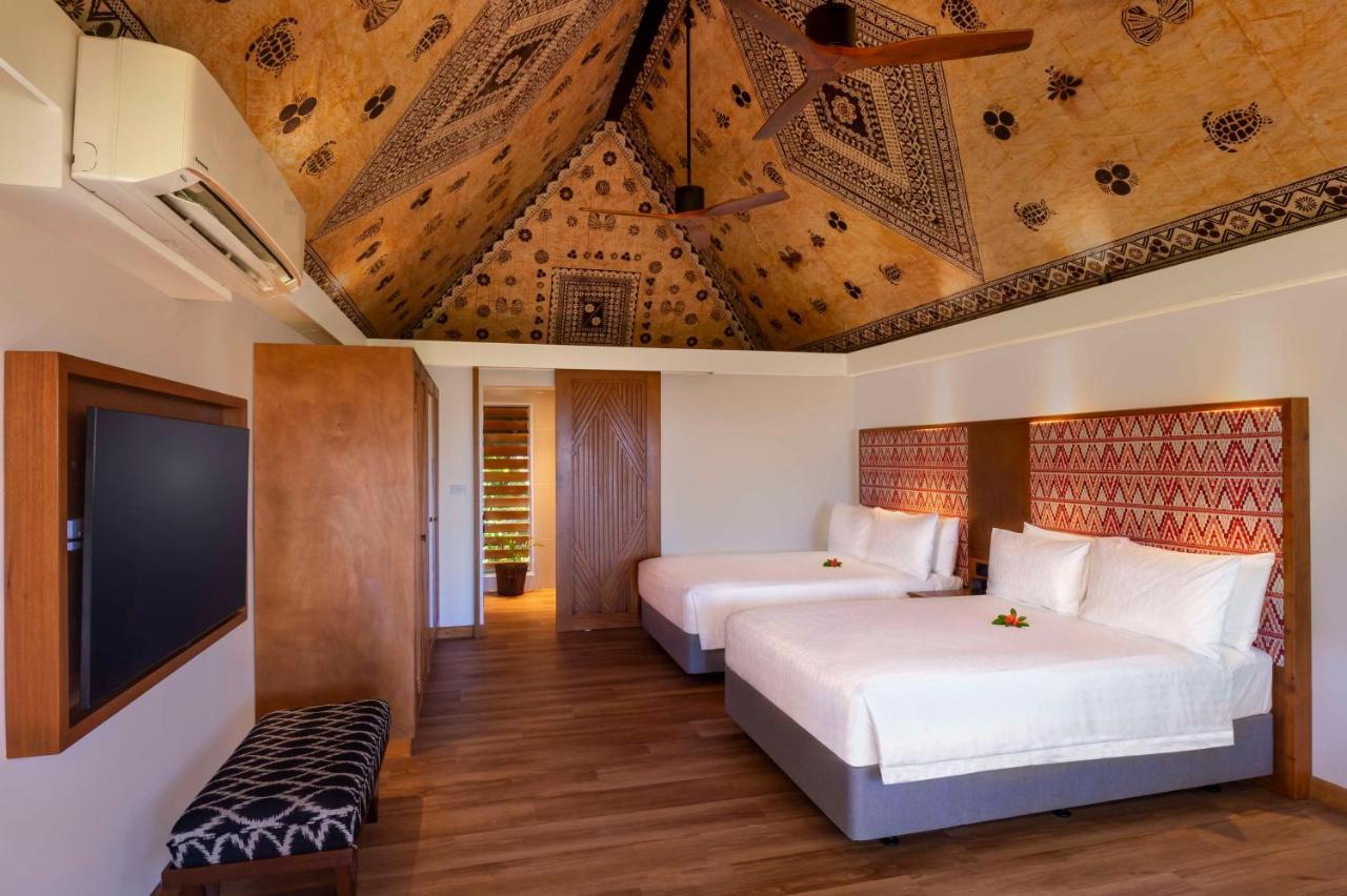 Outrigger Fiji Beach Resort Korotogo Zewnętrze zdjęcie A bedroom at the Sheraton Resort Fiji